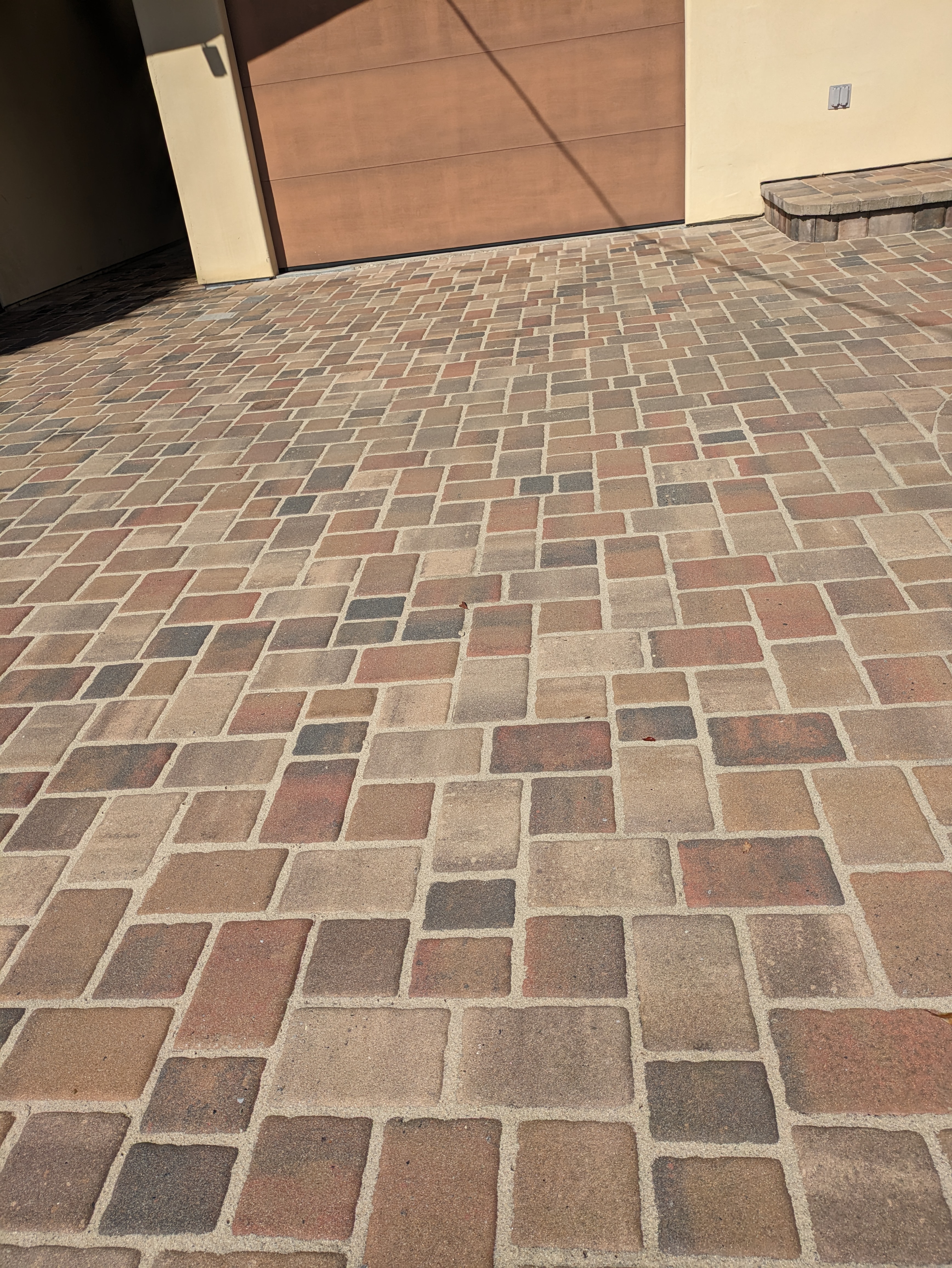 Clean Pavers and apply sand into joints, also seal pavers in Monterey CA